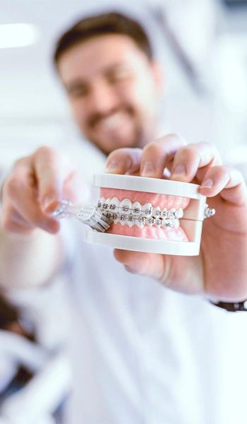 Perfect aligned teeth and beautiful smile after orthodontic treatment